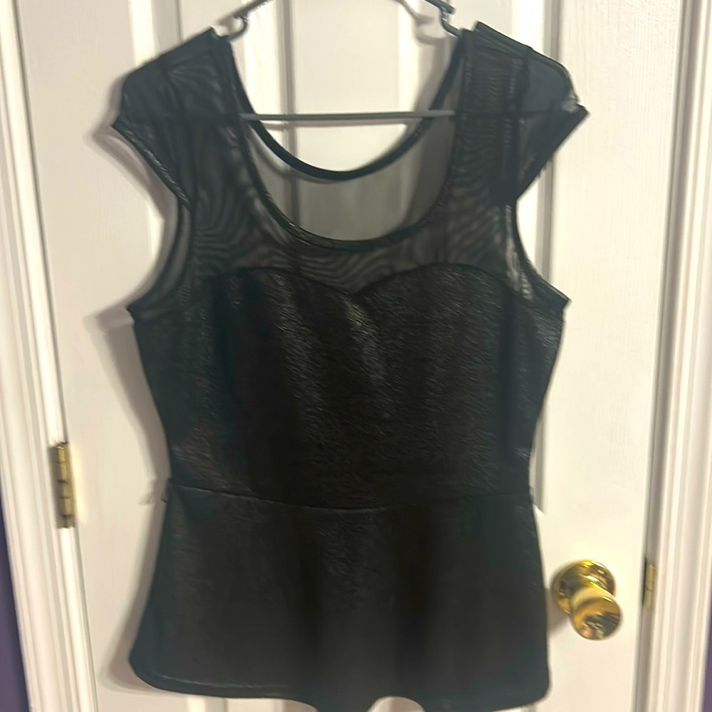 Size large peplum sparkly top with mesh design